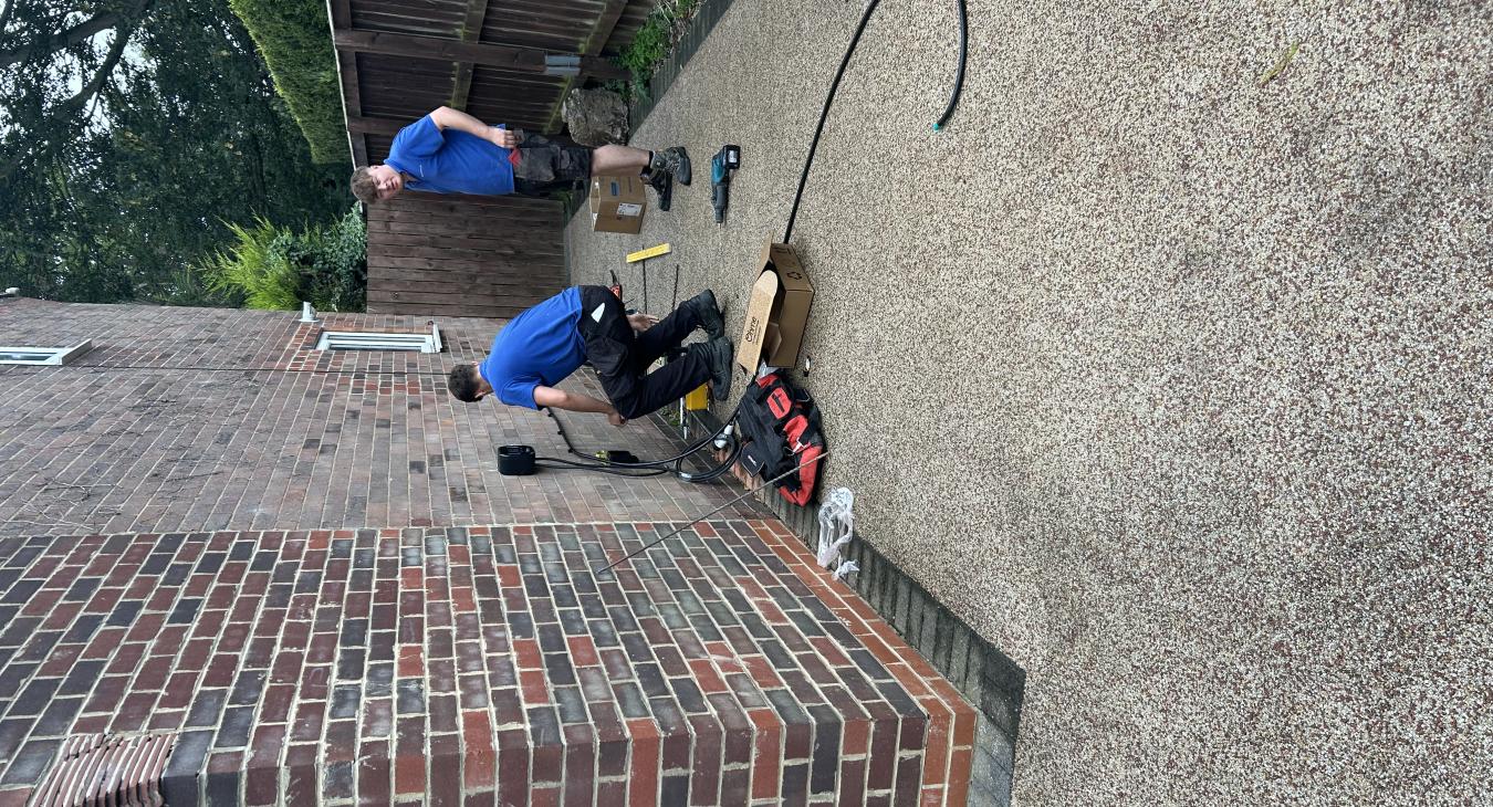 Oliver & Samson Cooking up and Fine EV Install before the Rain Comes down .